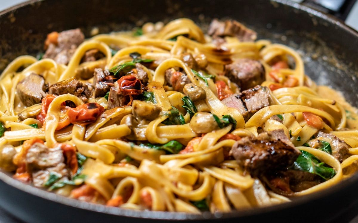 Fresh pasta tossed in a pan